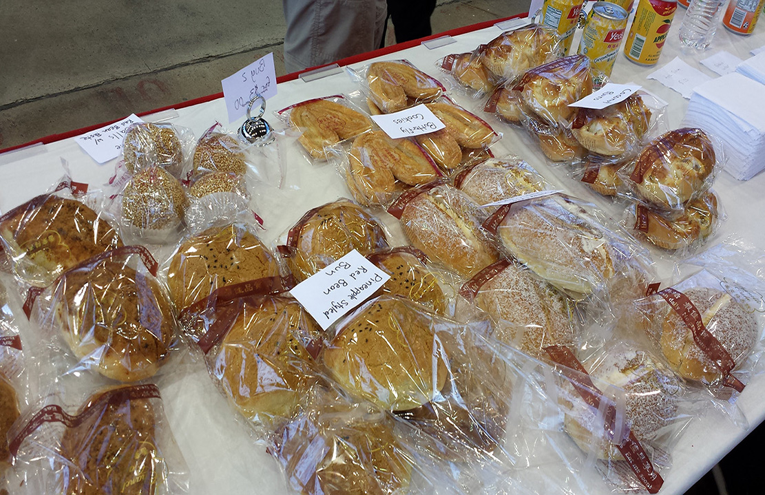 A vendor's view of the delicious breads from Grand Asia Market.